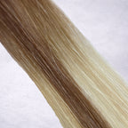 Studio Collection shade swatch in Bronzed Cashmere #T10P10/24/60, featuring a dimensional blend of soft petal blonde, cashmere blonde, and creamy vanilla blonde tones with bronzed ribboned highlights, a silky finish, and natural shine.

