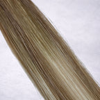 Studio Collection shade swatch in Champagne Bronde #B9A/60A, featuring a dimensional blend of soft fawn brunette and cool oatmilk blonde tones with creamy champagne bronde ribboned highlights, a silky finish, and natural shine.