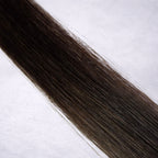 Luxury Remy human hair extension shade swatch in Espresso #2, featuring a rich warm dark brown tone with glossy depth, a silky finish, and natural shine.