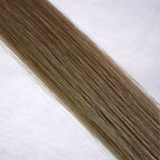 Luxury Remy human hair extension shade swatch in Fawn #9A from the Remalisse Studio Collection, featuring a soft cool blonde tone with muted ash-beige undertones, natural dimension, a silky finish, and natural shine.