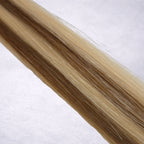 Studio Collection shade swatch in Honeycomb #P6/22, featuring a dimensional blend of warm chestnut brown and soft honey blonde tones with golden ribboned highlights, a silky finish, and natural shine.