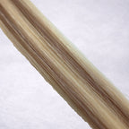 Studio Collection shade swatch in Iced Truffle #P613/10, featuring a dimensional blend of creamy blonde and soft petal blonde tones with cool beige ribboned highlights, a silky finish, and natural shine.