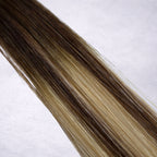 Studio Collection shade swatch in Mocha Melt #B4/18, featuring a dimensional blend of rich chocolate brunette and soft wheat blonde tones with smoky mocha ribboned highlights, a silky finish, and natural shine.