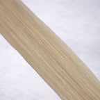 Luxury Remy human hair extension shade swatch in Oatmilk #60A from the Remalisse Studio Collection, featuring a very light cool blonde tone with soft creamy undertones, subtle dimension, a silky finish, and natural shine.
