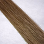 Luxury Remy human hair extension shade swatch in Petal #10 from the Remalisse Studio Collection, featuring a soft warm blonde tone with delicate rosy-beige undertones, subtle dimension, a silky finish, and natural shine.