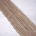 Luxury Remy human hair extension shade swatch in Silver #613A from the Remalisse Studio Collection, featuring a cool silver blonde tone with soft icy undertones, subtle dimension, a silky finish, and natural shine.