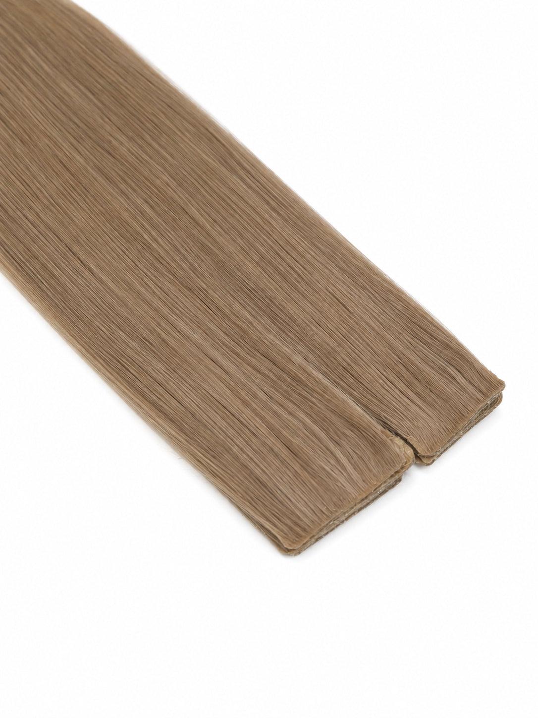Studio Collection injection tape-in hair extension in a cool ash taupe blonde shade, featuring muted beige and smoky blonde undertones, an ultra-flat seamless injection tab, silky straight Remy human hair, and a smooth natural finish against a clean white background.