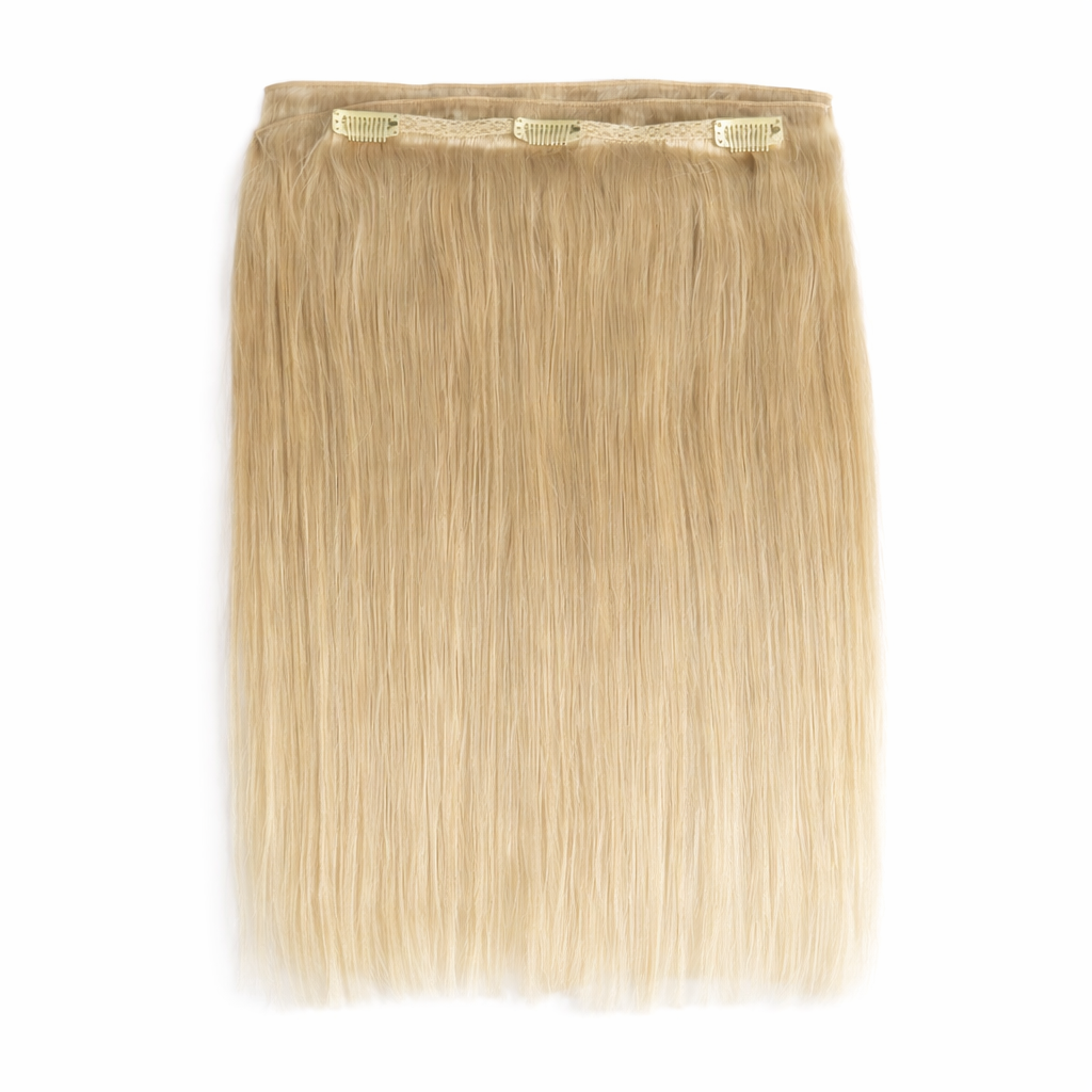 Remalisse blonde Genius weft clip in hair extensions full length with lace weft and secure clips on aa pure white background.
