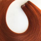 Close-up of Remalisse Studio Flat Weft hair extensions in a rich copper red shade displayed in a curved layout on a white background.