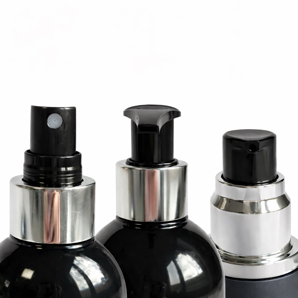 Close-up of Remalisse hair extension aftercare bottles showing pump and spray applicators for shampoo, conditioner, heat protection and argan oil serum. 