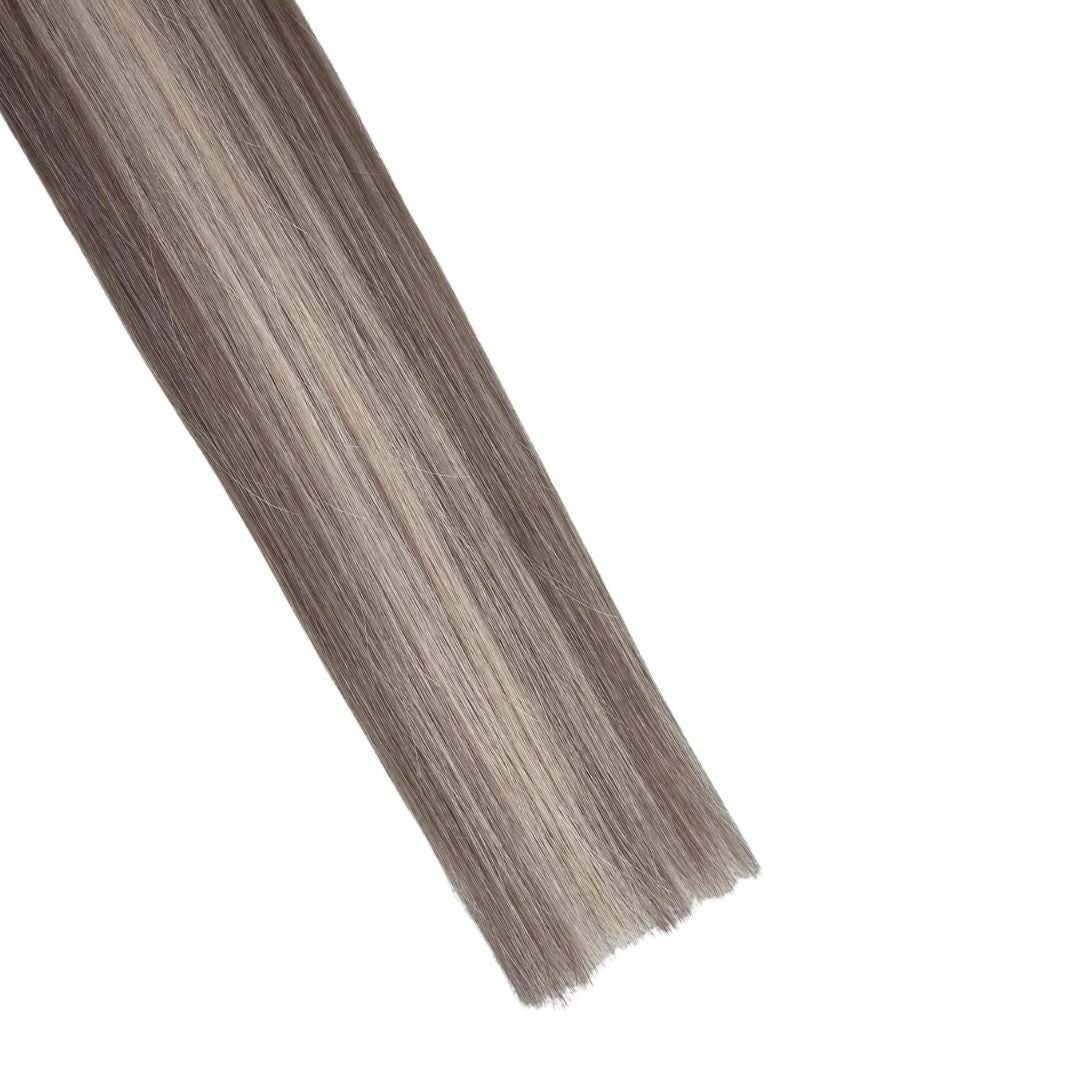 Side view close up of Remalisse Genius Weft hair extension ends showing thick, double drawn density.