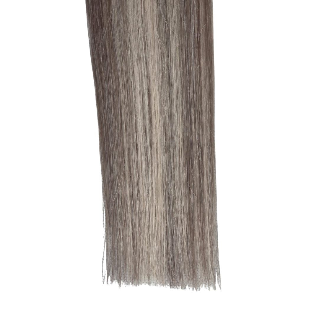Close up of Remalisse Genius Weft hair extensions ends showing thick, double drawn density.