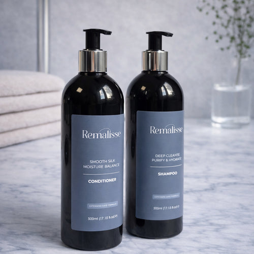 Remalisse Deep Cleanse Shampoo ans Smooth Silk Conditioner 500ml bottles on marbe surface luxury hair extension aftercare. 