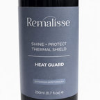 Close-up of  Remalisse Shine and Protect Thermal Shield Heat Guard label on a black haircare bottle showing product name and 250ml size. 