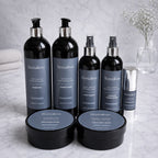 Remalisse professional hair extension aftercare collection including shampoo, conditioner, treatment masks, protein spray, silk restore leave-in conditioner, heat protection and argan oil serum displayed on marble background. 
