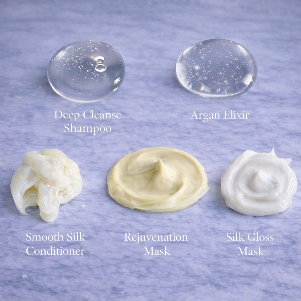 Textures of Remalisse hair extension aftercare products including Deep Cleanse Shampoo, Argan Elixir oil, Smooth Silk Conditioner, Rejuvenation Mask and ilk Gloss Mask displayed on a marble background. 