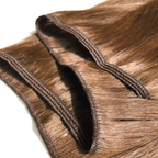 Close-up of multiple Remalisse volume weft hair extensions layered over one another, showing the stitched weft construction, flexible seams and smooth brunette hair texture with a natural shine