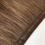 Close-up comparison of a Remalisse volume weft hair extension showing both the underside and outer side of the weft construction, highlighting the stitched seam, hair density and flexible weft design in a brunette shade.