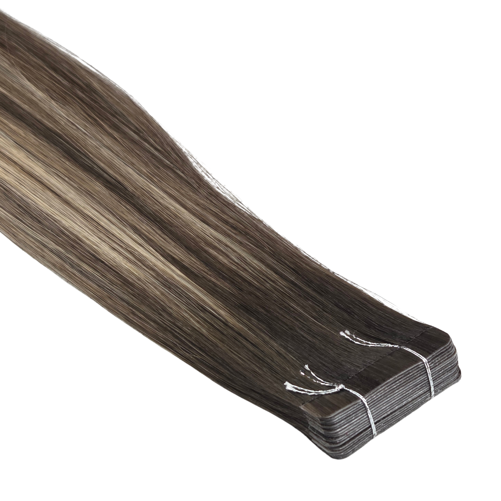 Dark brunette tape-in hair extensions displayed in a smooth straight finish with stacked adhesive tabs secured together at the top. Sleek Remy human hair showcases a seamless tape design with natural shine against a clean white background.